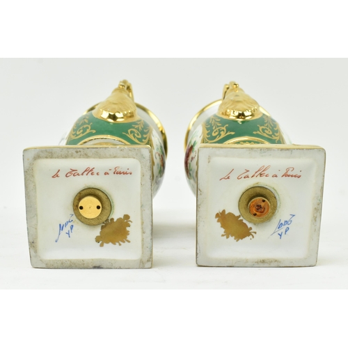 178 - La Tellac a Paris - a pair of early 20th century porcelain figural urns. Each urn with gilded flared... 