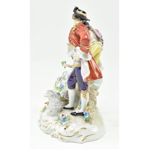 182 - An early 20th century Sitzendorf German porcelain figurine of a courting Regency couple. The gent de... 