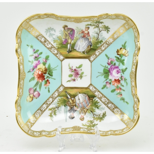 189 - An early 19th century continental hand painted porcelain squared platter. The platter with gilt scro... 