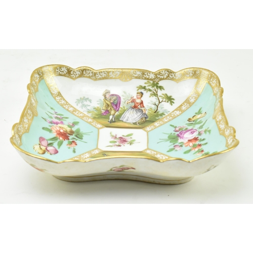 189 - An early 19th century continental hand painted porcelain squared platter. The platter with gilt scro... 