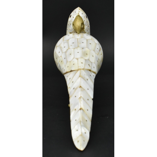 21 - A 19th century Anglo-Colonial mother of pearl and brass figurine of a bird. The parrot bird featurin... 