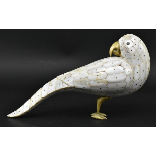 21 - A 19th century Anglo-Colonial mother of pearl and brass figurine of a bird. The parrot bird featurin... 