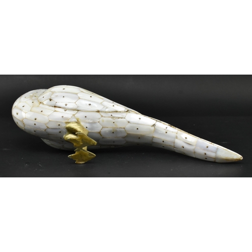 21 - A 19th century Anglo-Colonial mother of pearl and brass figurine of a bird. The parrot bird featurin... 