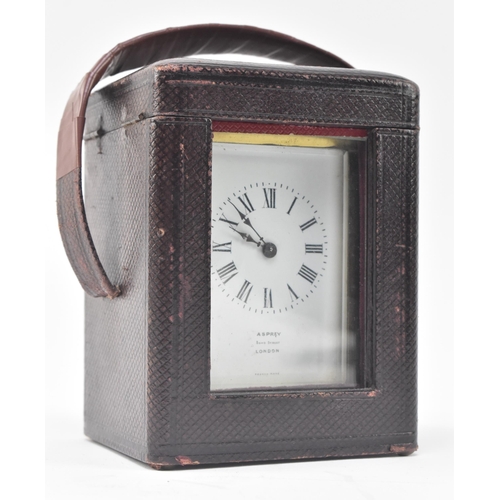 23 - Asprey, London - an early 20th century glass & brass French made carriage clock in original leat... 