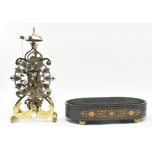 31 - An early 20th century brass single fusee movement skeleton mantel clock in glass dome. The clock hav... 