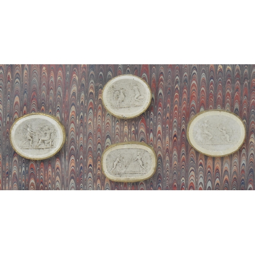 50 - A collection of twenty-six 19th century Italian Grand Tour plaster casts cameo roundels after intagl... 