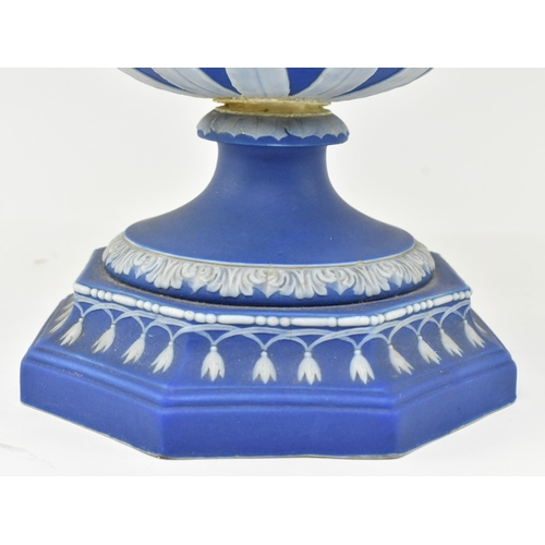 58 - A 19th century Wedgwood blue Jasperware Leda & Swan urn vase. The urn having a flared rim over t... 