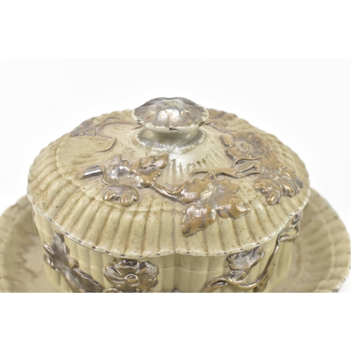 61 - Villeroy & Boch, Mettlach. A continental German 19th century silvered painted stoneware lidded b... 