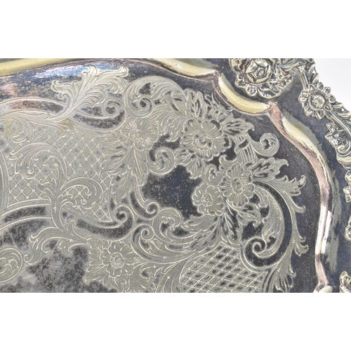 64 - A large late 19th / early 20th century High Victorian silver plated ornate serving tray. The tray ha... 