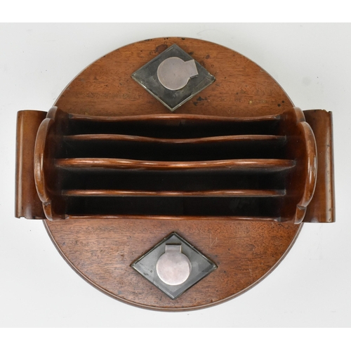 66 - A 19th century carved mahogany circular desk tidy with inkwells. The desk tidy having a central four... 