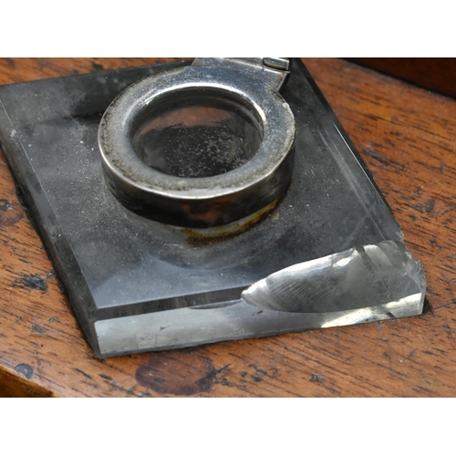 66 - A 19th century carved mahogany circular desk tidy with inkwells. The desk tidy having a central four... 