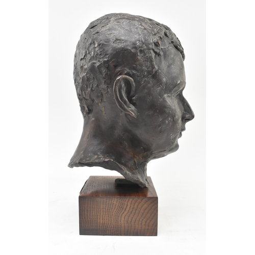 69 - A 20th century lost wax bronze sculpture of child's head. The study depicting the subject frontally,... 