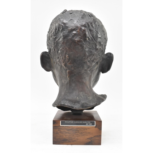 69 - A 20th century lost wax bronze sculpture of child's head. The study depicting the subject frontally,... 