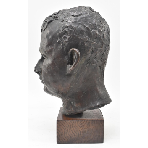 69 - A 20th century lost wax bronze sculpture of child's head. The study depicting the subject frontally,... 