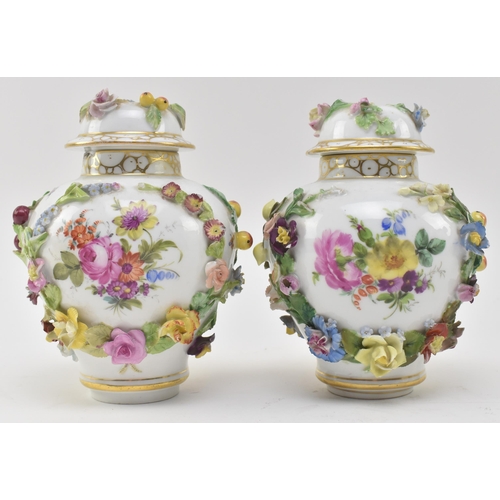 71 - Carl Thieme, Germany - a pair of continental late 19th century hand painted fine bone china lidded u... 