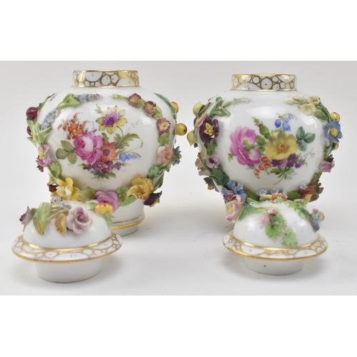 71 - Carl Thieme, Germany - a pair of continental late 19th century hand painted fine bone china lidded u... 