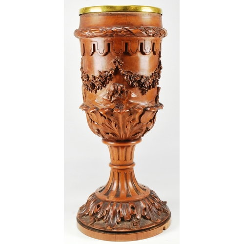 81 - A large 19th century ecclesiastical carved wooden goblet chalice of ornate form. Circular base carve... 