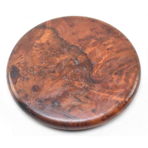 83 - A figured walnut solitaire circular board with polished hardstone geological specimen marbles. The b... 