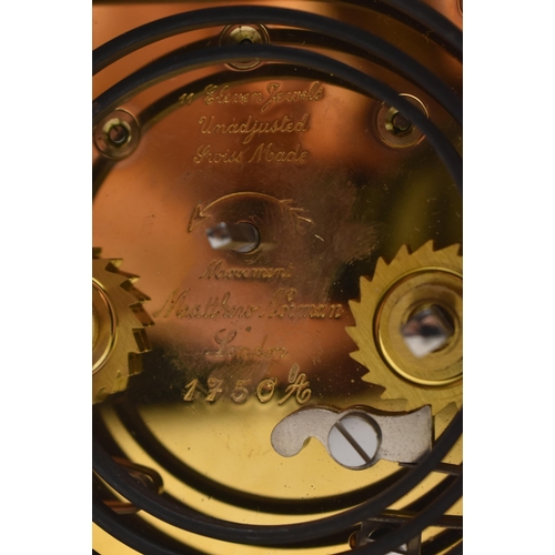 84 - Matthew Norman - an early 20th century Swiss made brass carriage clock. The clock of typical form, b... 