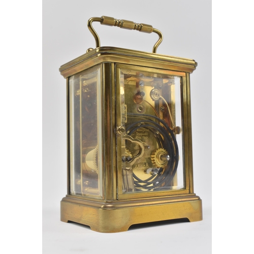 84 - Matthew Norman - an early 20th century Swiss made brass carriage clock. The clock of typical form, b... 