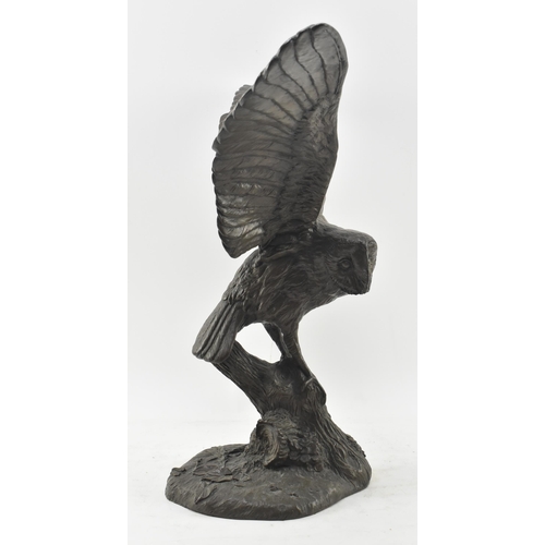 87 - Jeanne Rynhart (Irish, 1946-2020) - a 20th century large bronzed resin sculpture of a barn owl. The ... 