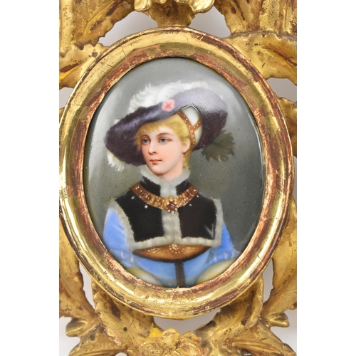 96 - A pair of Victorian 19th century hand painted miniature oval portrait paintings on porcelain in gilt... 