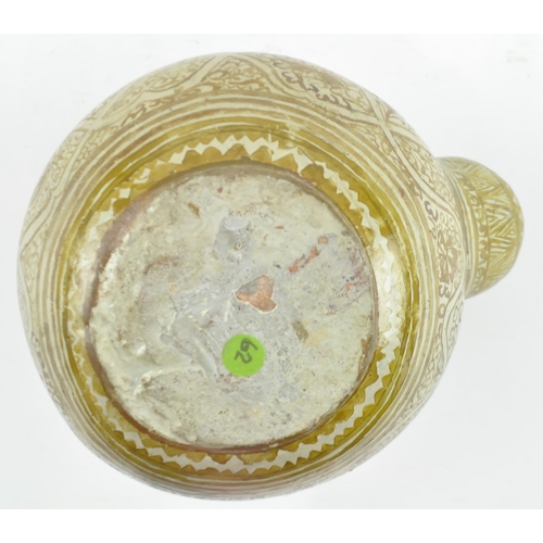 136 - A South Eastern Thai Sawankhalok kendi, the ceramic globular body with mammiform spout, beneath a fl... 