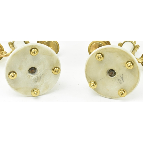 51 - Mougin - an early 20th century French two train white marble and gilt brass eight day movement porti... 