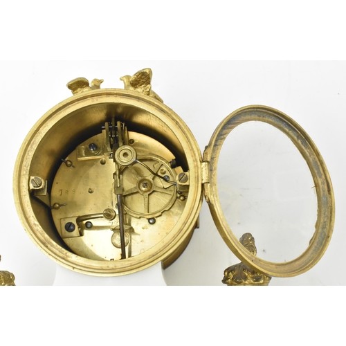 51 - Mougin - an early 20th century French two train white marble and gilt brass eight day movement porti... 