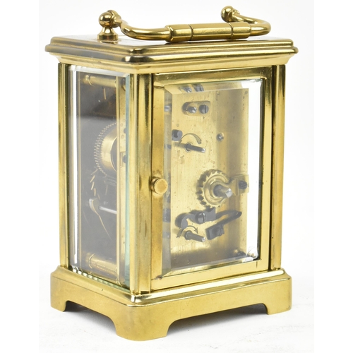 57 - J. Garnier, Paris - a French 19th century brass desk bell striking chime to base carriage clock. The... 