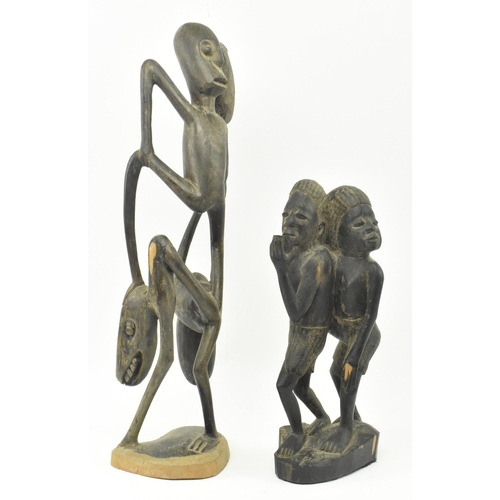 63 - Two Makonde People Tanzanian hand carved wood tribal indigenous sculptures figures. The lot to inclu... 