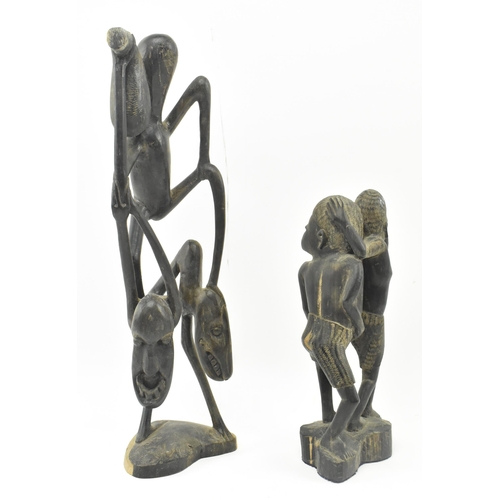 63 - Two Makonde People Tanzanian hand carved wood tribal indigenous sculptures figures. The lot to inclu... 