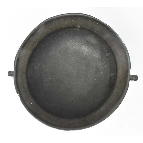 72 - A 17th century West Country cast bronze traveller's cauldron pot. The travelling cauldron with point... 