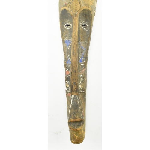 76 - Fang Tribe - Cameroon - a Central African carved & painted wood elongated mask. The mask depicti... 