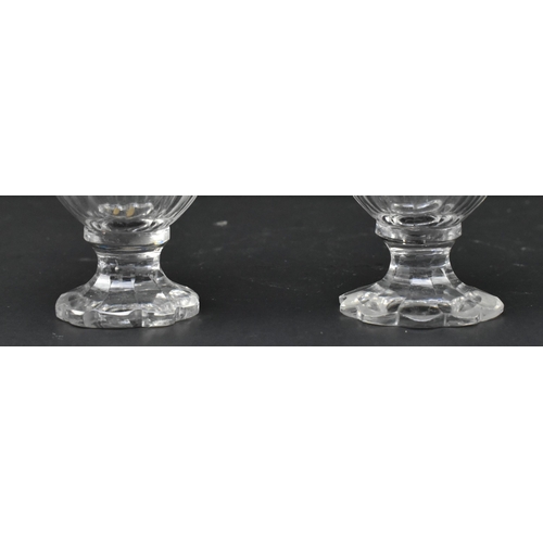 118 - A pair of early 19th century cut glass and silver plated condiment pots. Each with silver plated cir... 