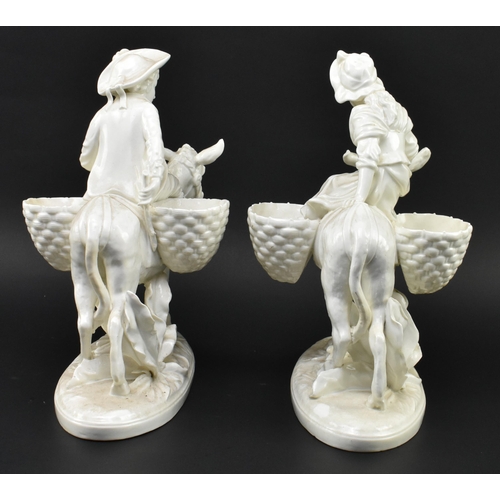 163 - A pair of Victorian 19th century Moore Bros white glazed ceramic figures of male & female on don... 