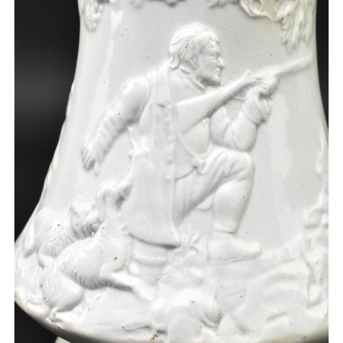 176 - A Victorian 19th century white salt glazed pitcher. The jug relief moulded with hunting scenes with ... 