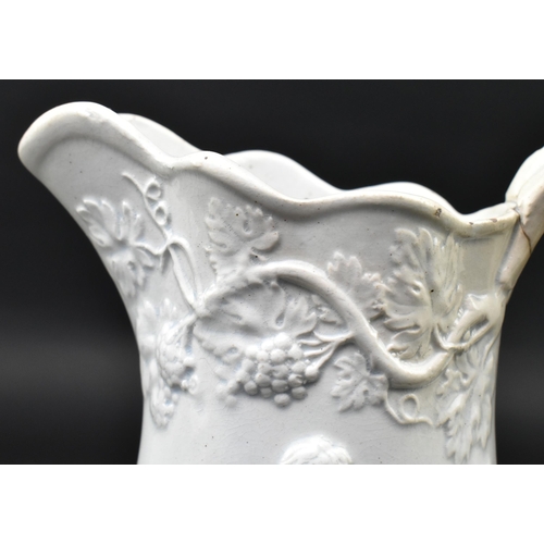 176 - A Victorian 19th century white salt glazed pitcher. The jug relief moulded with hunting scenes with ... 