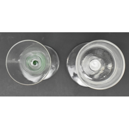 97 - Two mid to late 18th century George II / George III opaque twist stem wine glasses. The lot comprisi... 