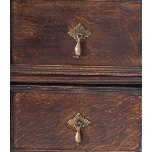 263 - A late 17th century oak chest of drawers on stand / tallboy. The chest having a rectangular flared t... 