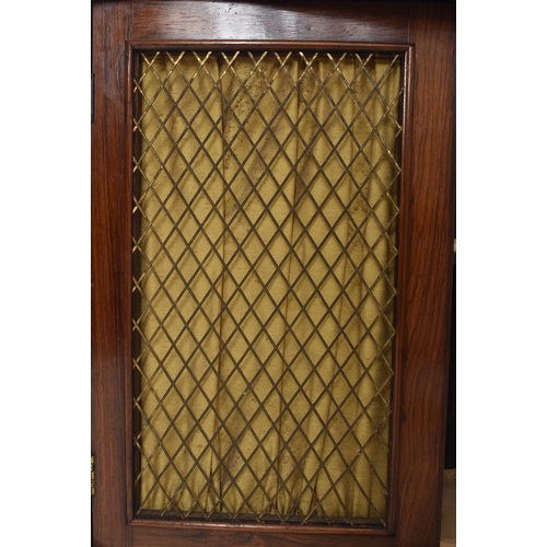 265 - A 19th century rosewood & lattice work marble top serpentine pier cabinet. The cupboard having a... 