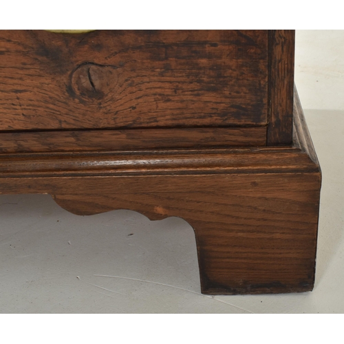 267 - An 18th century oak & marquetry inlaid livery cupboard press. The cupboard having a flared pedim... 