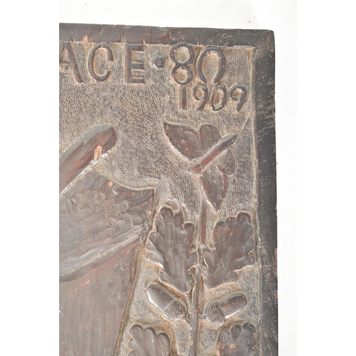 272 - An early 20th century 1909 carved oak pub sign / carved panel. The sign carved in relief by J. Vick ... 