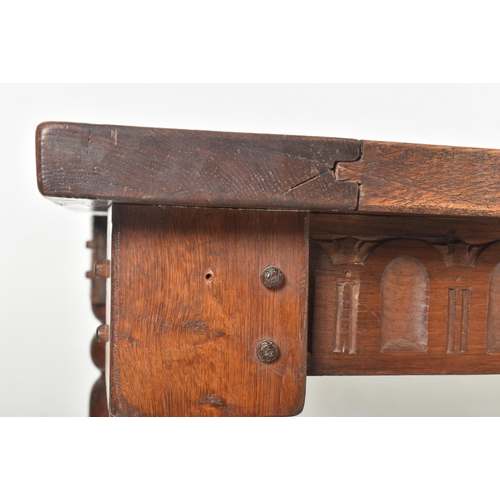 275 - A large 19th century solid oak refectory farmhouse dining table. The table having a rectangular top ... 