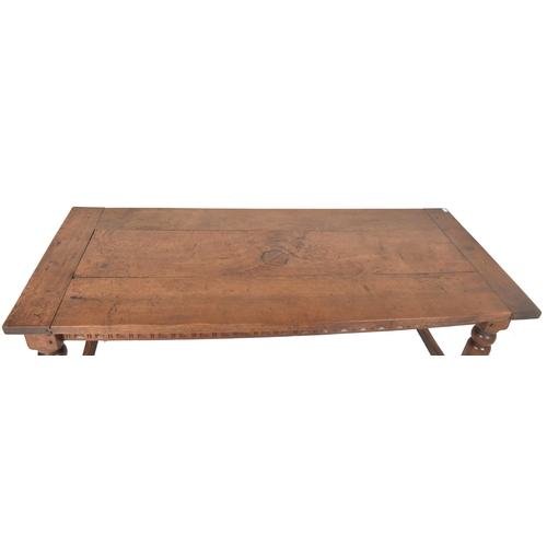 275 - A large 19th century solid oak refectory farmhouse dining table. The table having a rectangular top ... 