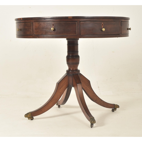 276 - A George III mahogany & leather top drum game rent table with drawers. The table having a circul... 