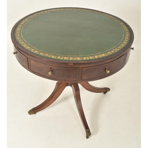 276 - A George III mahogany & leather top drum game rent table with drawers. The table having a circul... 