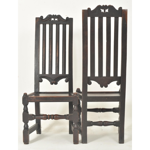 279 - A pair of Carolean 17th century carved oak railed back hall - dining chairs. Each having a carved sc... 