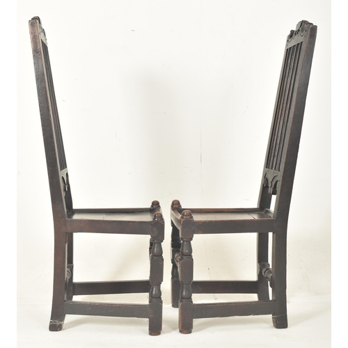 279 - A pair of Carolean 17th century carved oak railed back hall - dining chairs. Each having a carved sc... 