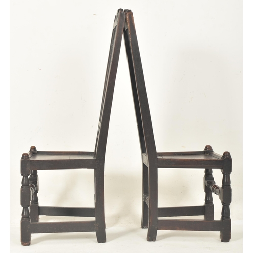 279 - A pair of Carolean 17th century carved oak railed back hall - dining chairs. Each having a carved sc... 